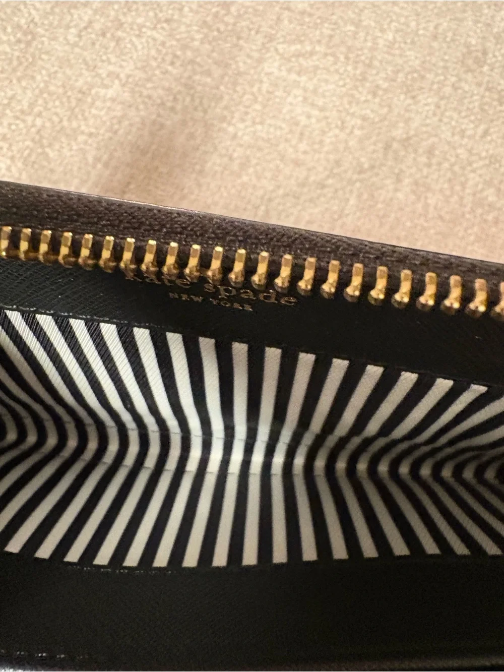 kate spade Black Zip-Around Wallet with Gold Logo